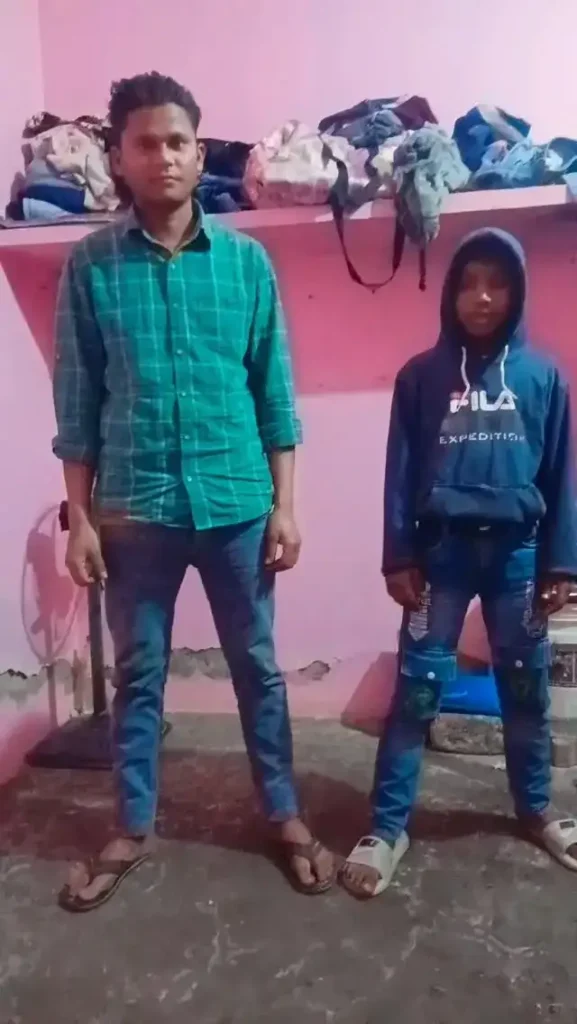 posing with a tech-focused background.