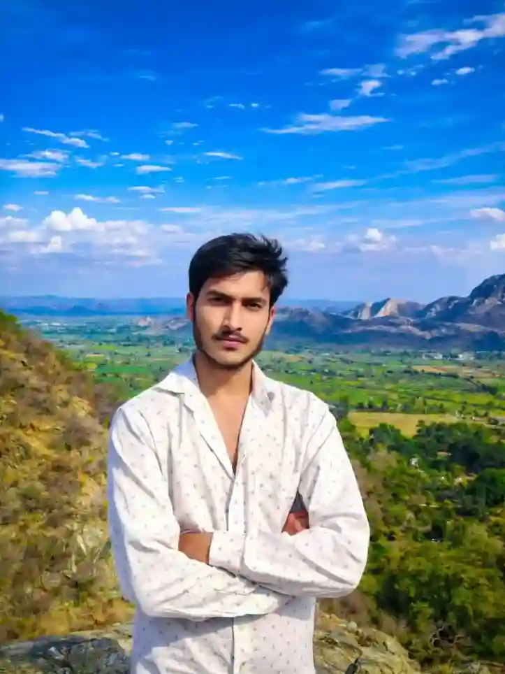 Young man leaning on a colorful painted wall for a vibrant street photo