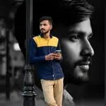 Outdoor portrait of a man in layered autumn clothing looking away