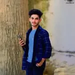 Model posing against a historic heritage fort wall for an epic portrait