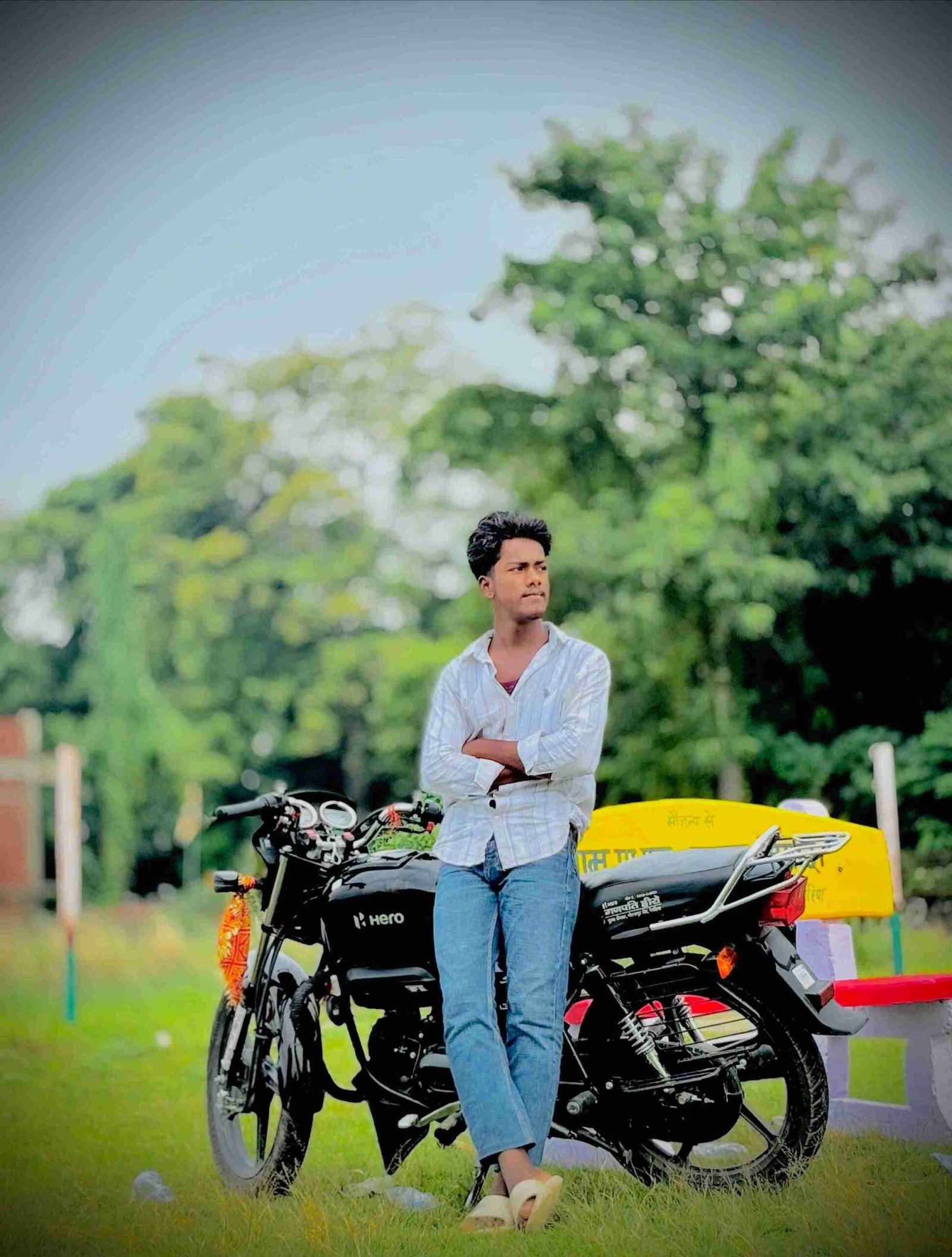 Ajay Kumar standing on rooftop with city skyline background