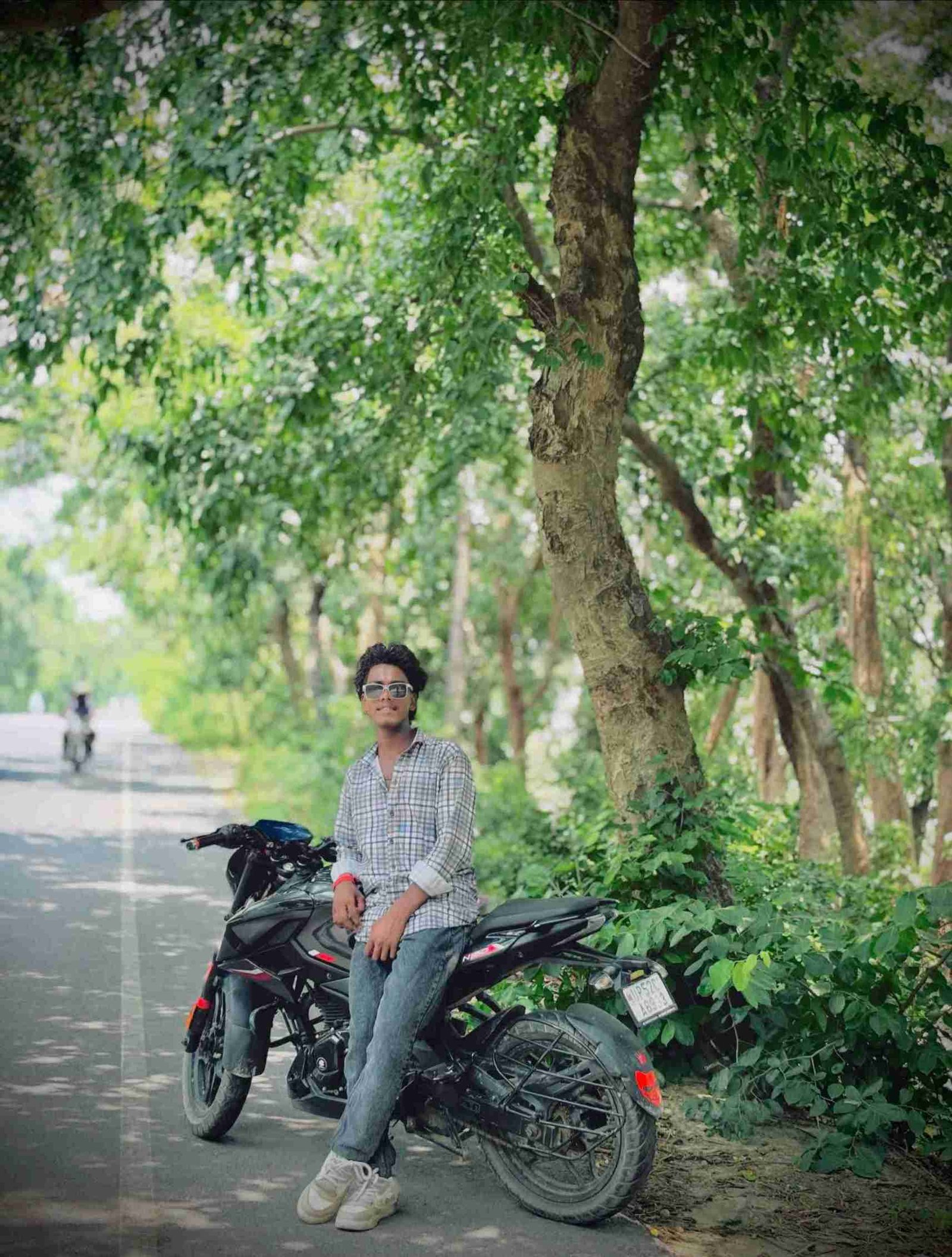 Ajay Kumar standing against scenic mountain view photography