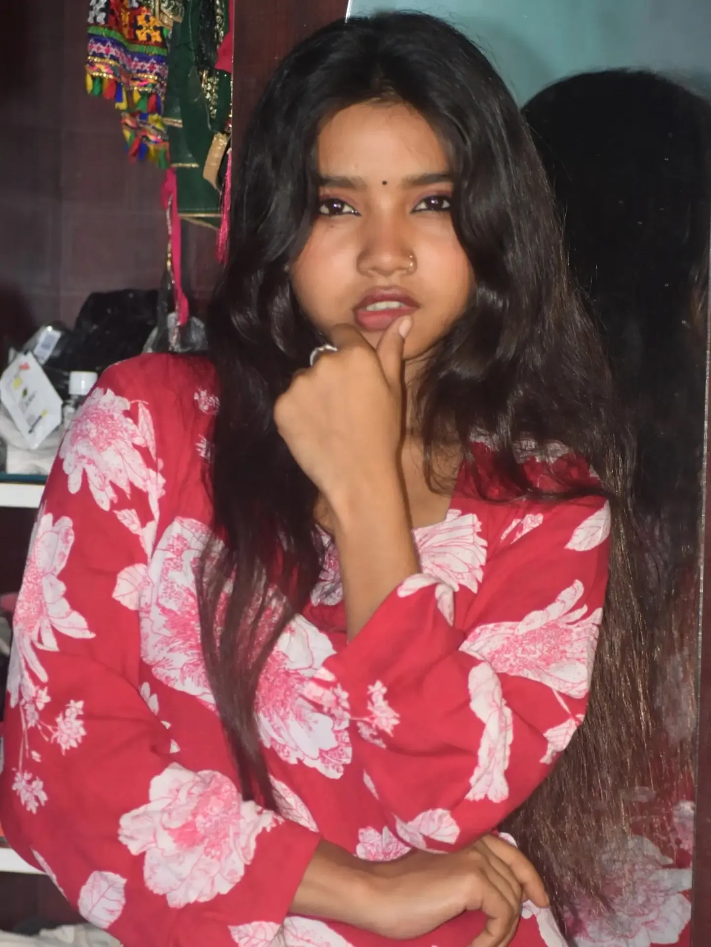 Anupama candid smile pose sitting comfortably on an outdoor bench