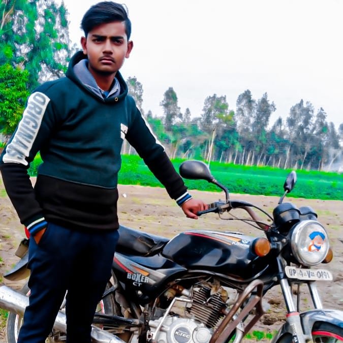 Saini posing with city skyline background