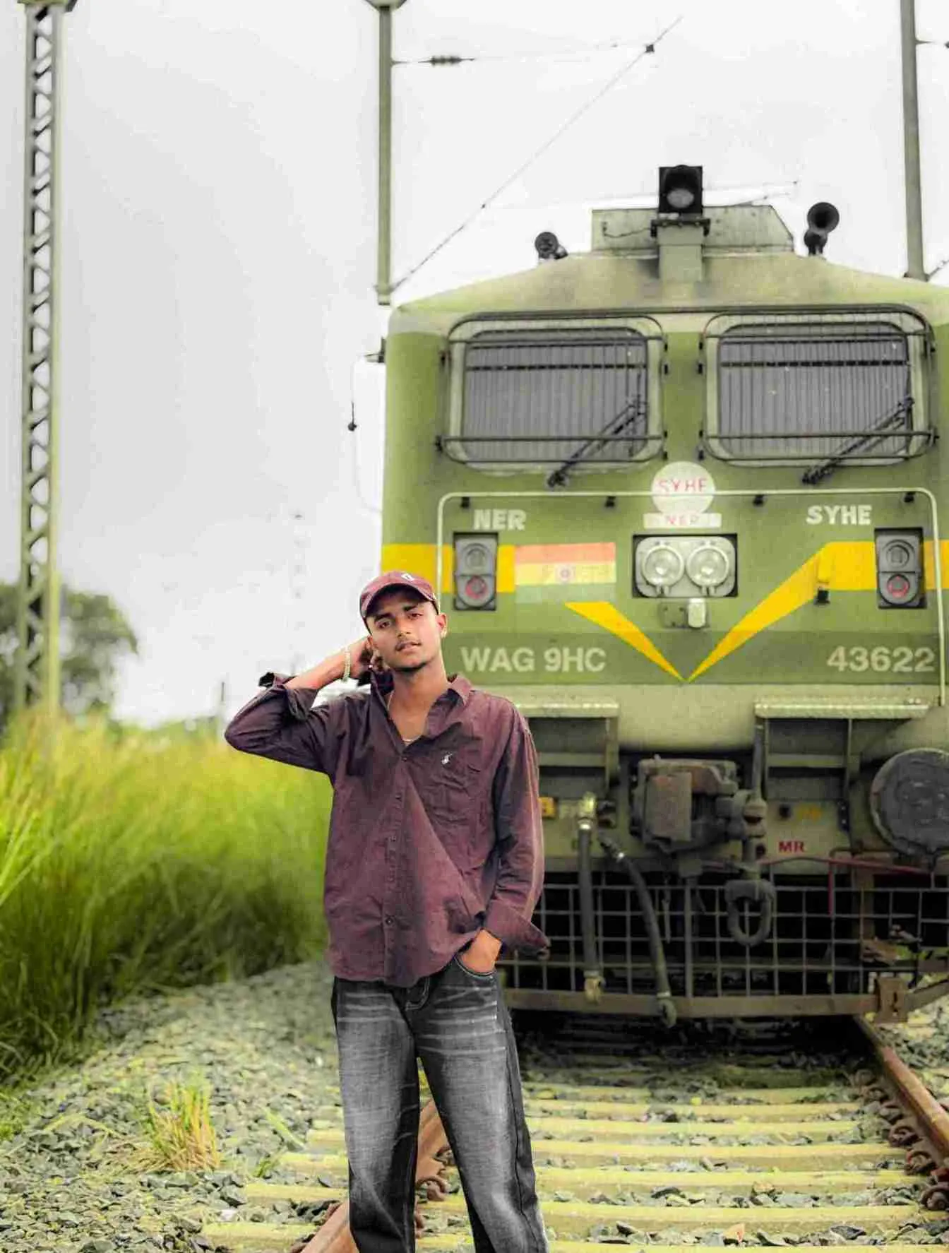 Rayeen posing in formal urban attire on location