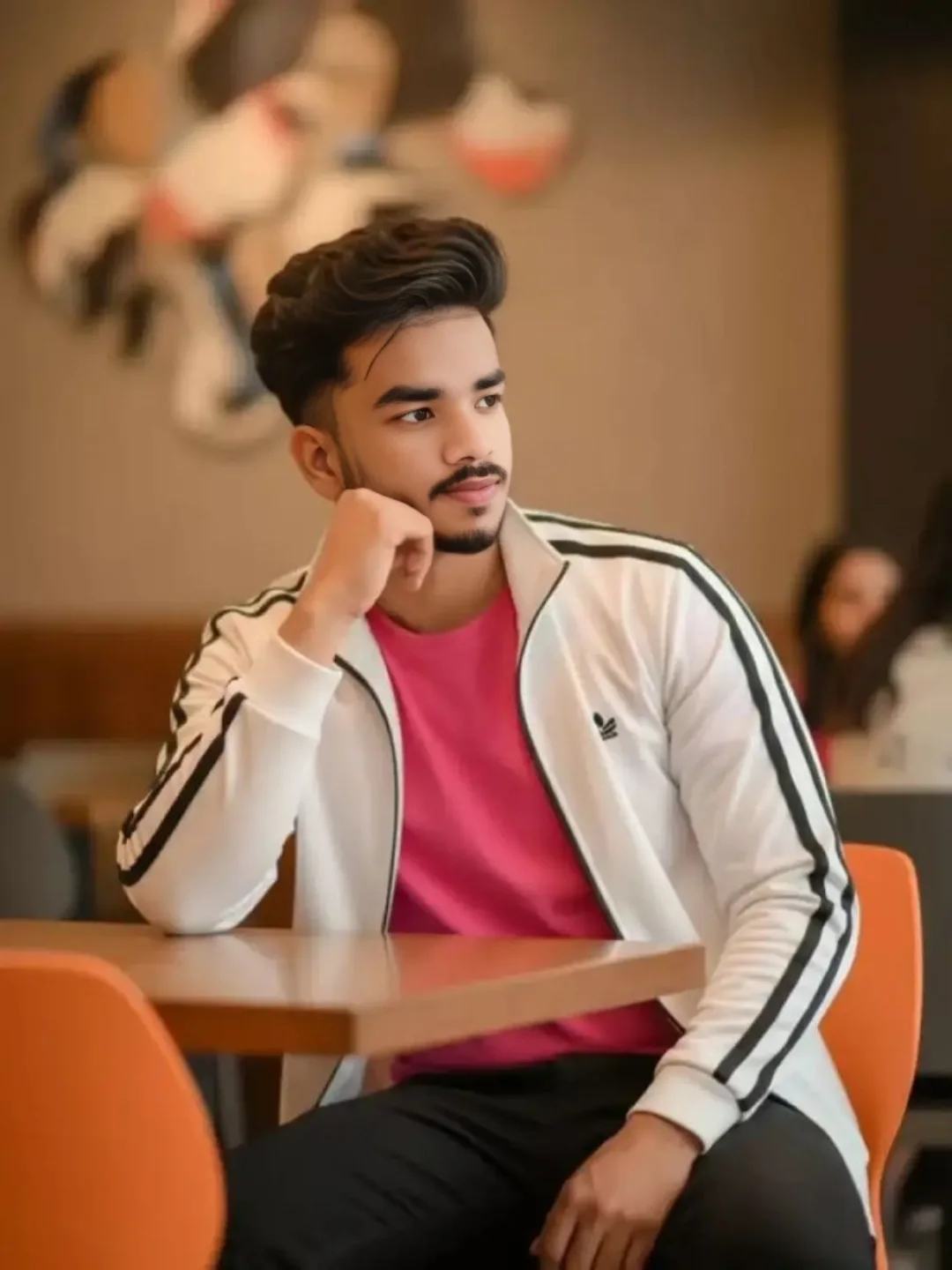 Chaurasia couple sharing a cozy candid moment in casual outfits