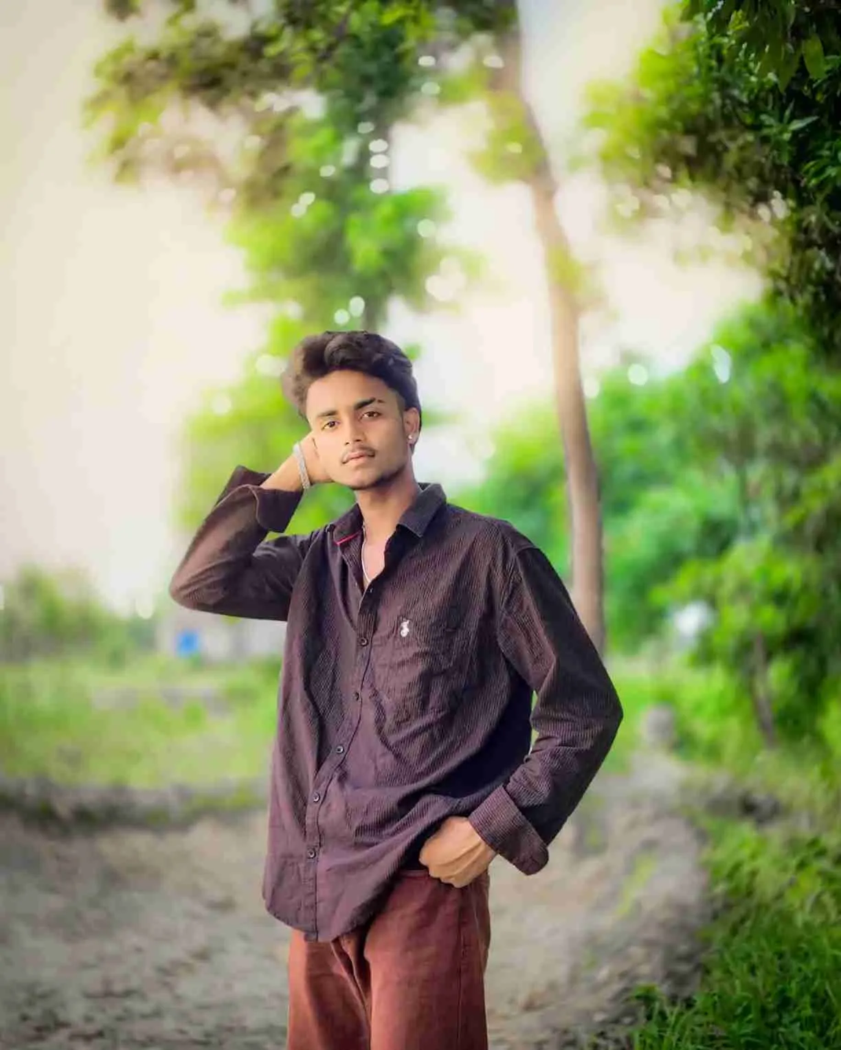 Rayeen in a trendy modern outfit posing stylishly for photo gallery
