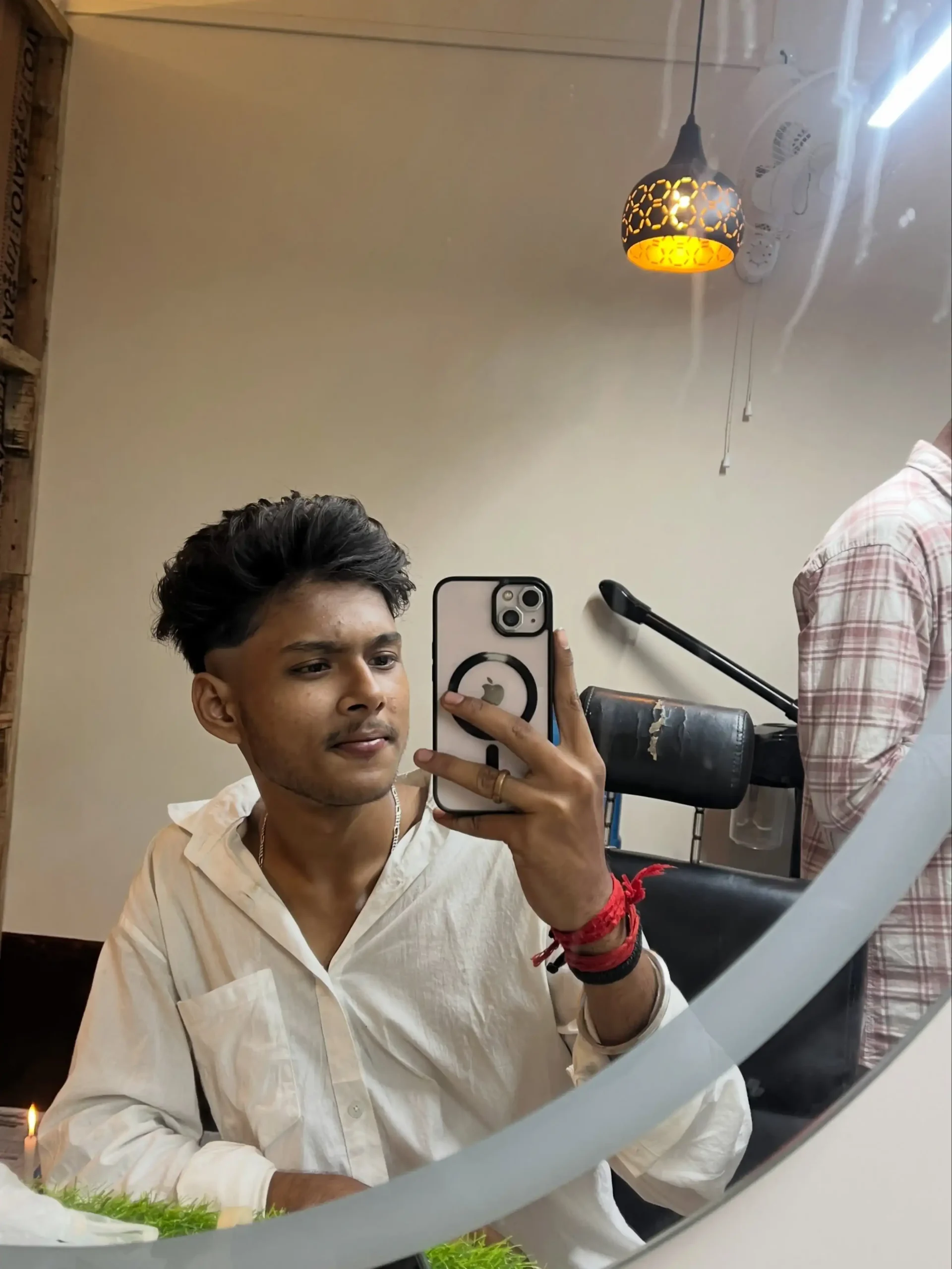 Subham posing beside a motorcycle